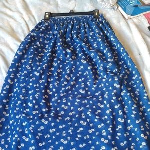 Juniors long blue skirt with mini sunflower print